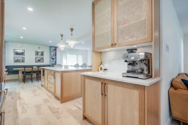 A cane-fronted desk nook off the kitchen — kitchen renovation by Corey Bowen Construction in Hudson, QC
